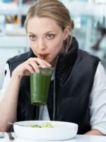 Amanda Seyfried The Dropout S01 Black Puffer Vest