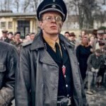 Blood and Gold 2023 Alexander Scheer Black Coat