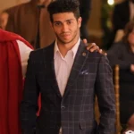 Hotel for the Holidays Mena Massoud Plaid Blazer
