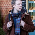 The Portable Door 2023 Patrick Gibson Brown Coat