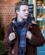 The Portable Door 2023 Patrick Gibson Brown Coat
