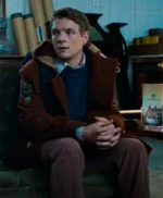 The Portable Door 2023 Patrick Gibson Brown Coat