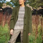 Claudia Winkleman The Traitors UK Green Coat